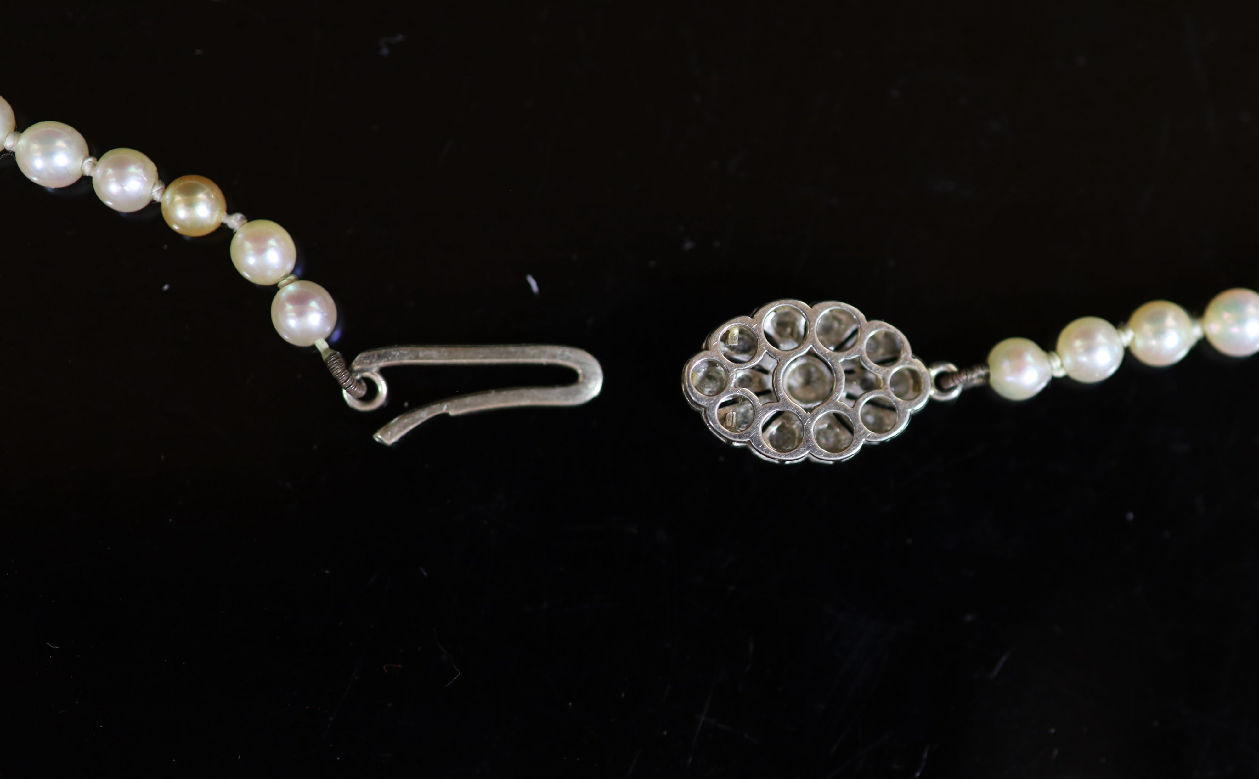 An early 20th century yellow metal and opal? set stick pin, 7cm, gross weight 2.4 grams.